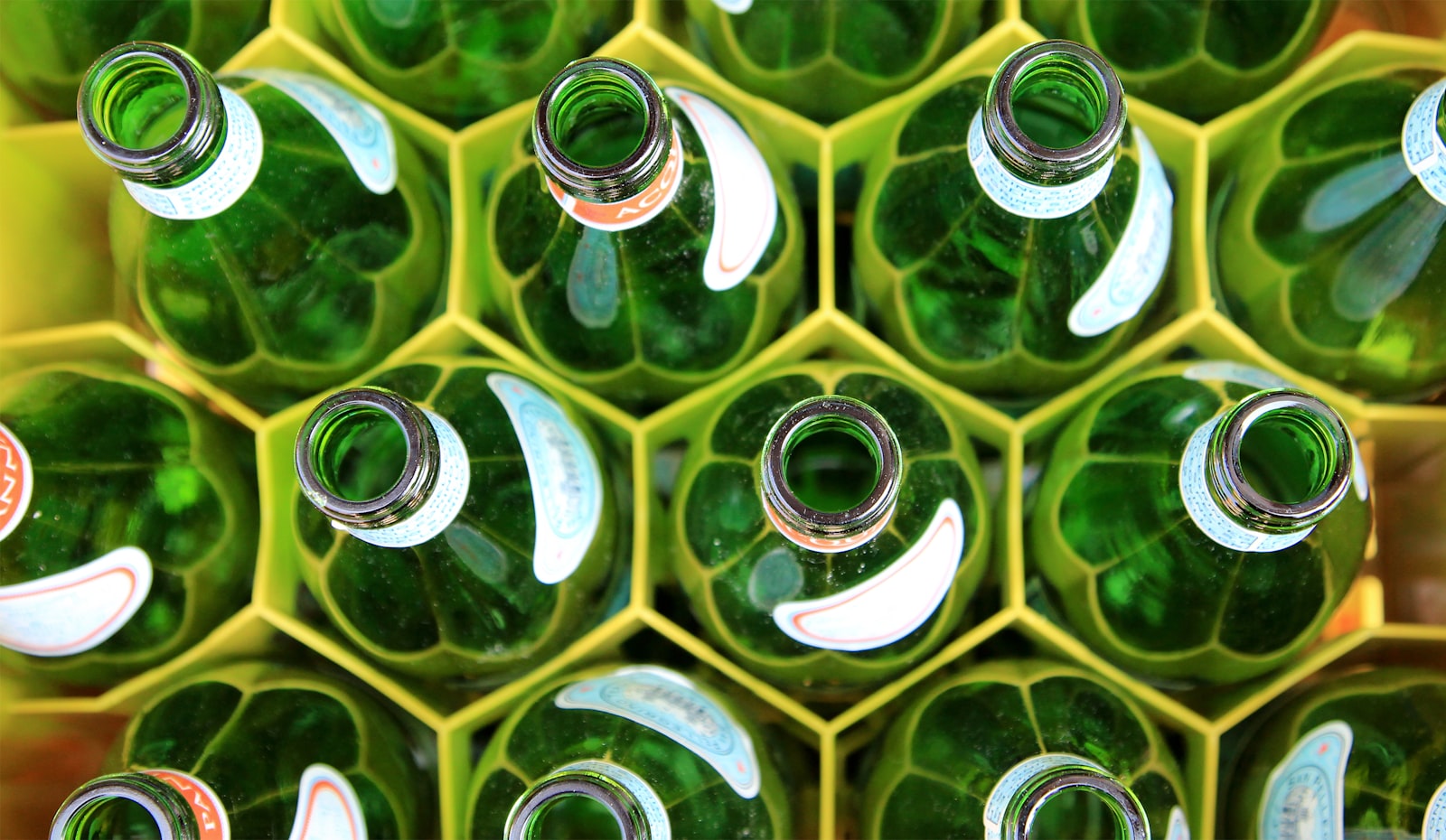 Green glass bottles packed together